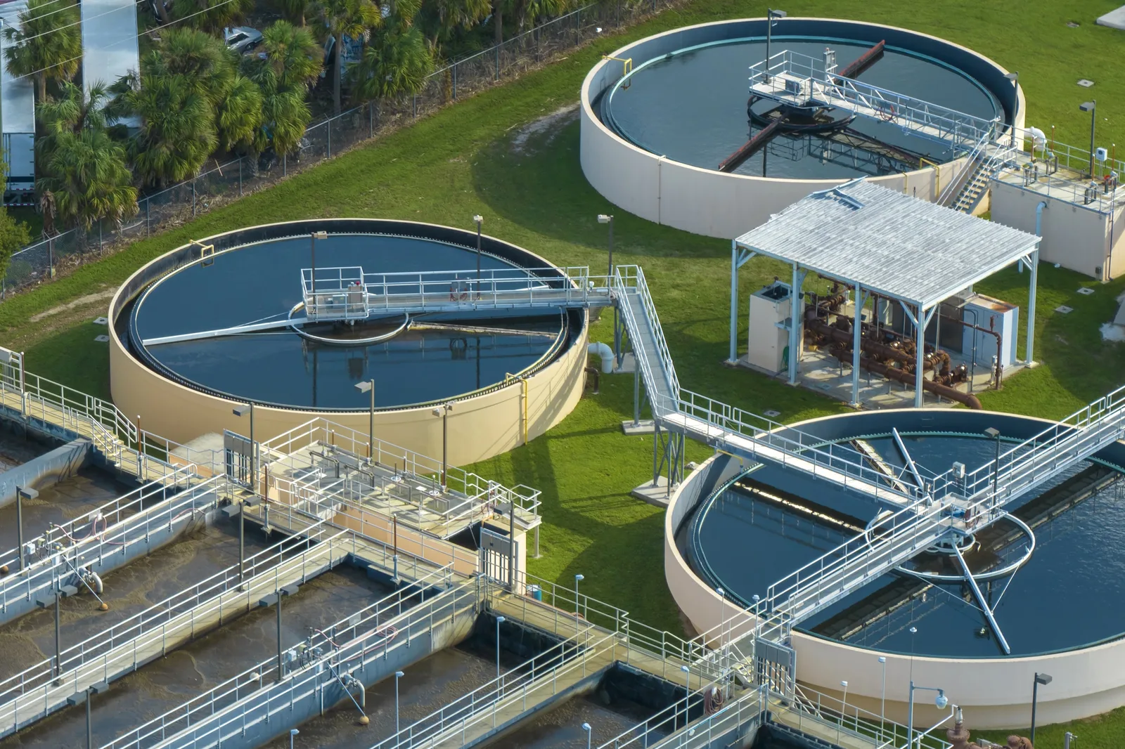 Aerial view of circular clarifier basins at a municipal water treatment facility.